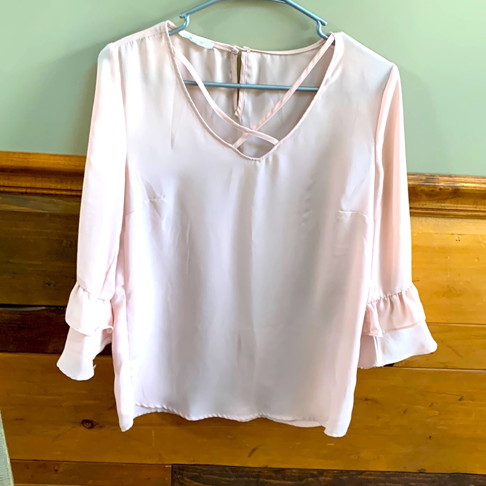 Light pink blouse with ruffled sleeves